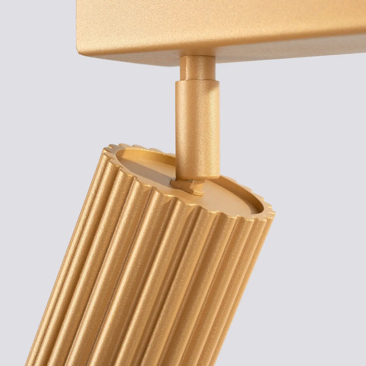 Plafonnier karbon allie de couleur or avec abat-jour cylindrique cannelé finition métallique design minimaliste ampoules gu10 interchangeables