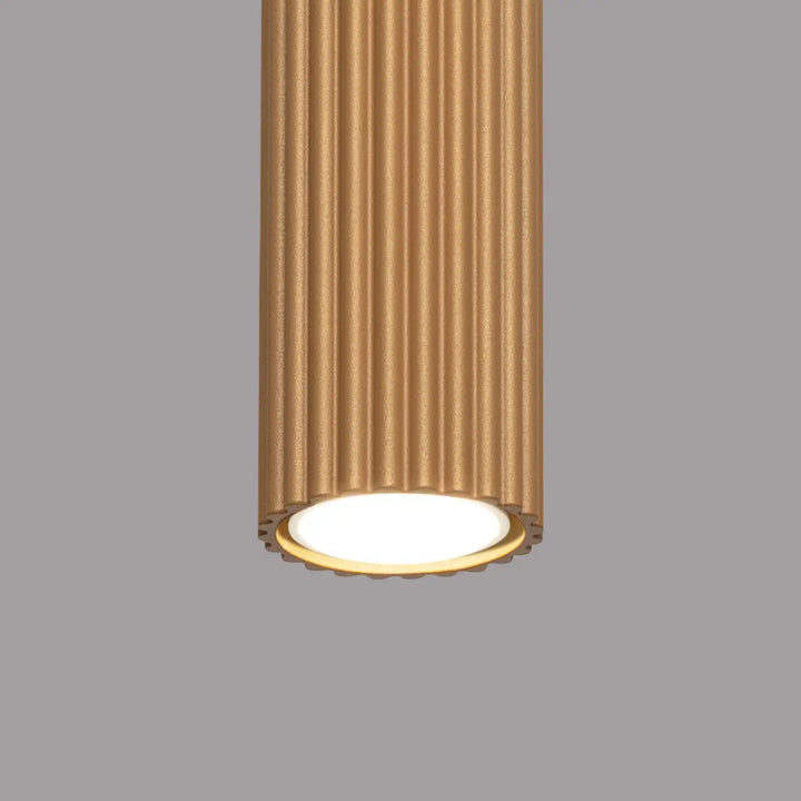 Plafonnier karbon en or à texture cannelée verticale avec ampoules gu10 interchangeables et design minimaliste