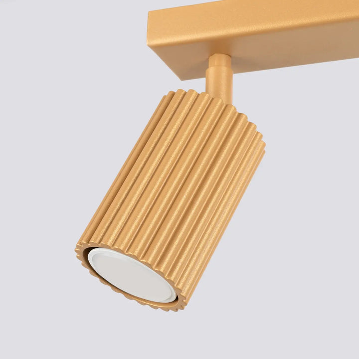 Plafonnier karbon allie avec design minimaliste finition or cylindre rainuré et ampoules gu10 interchangeables blanc