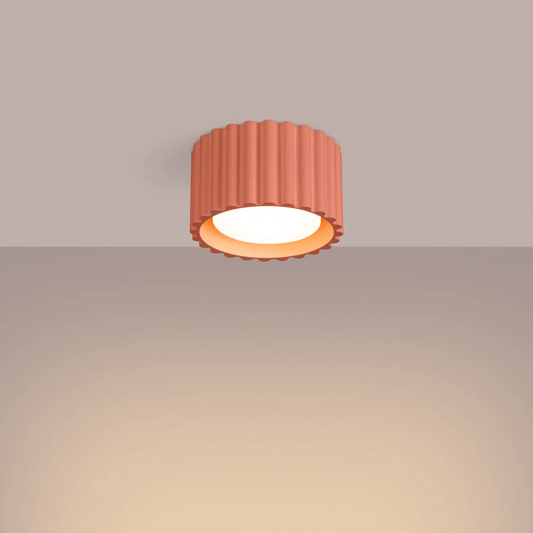 Luminaire plafonnier aura 1 peach corail forme unique inspirée avec lumière chaude et surface rainurée
