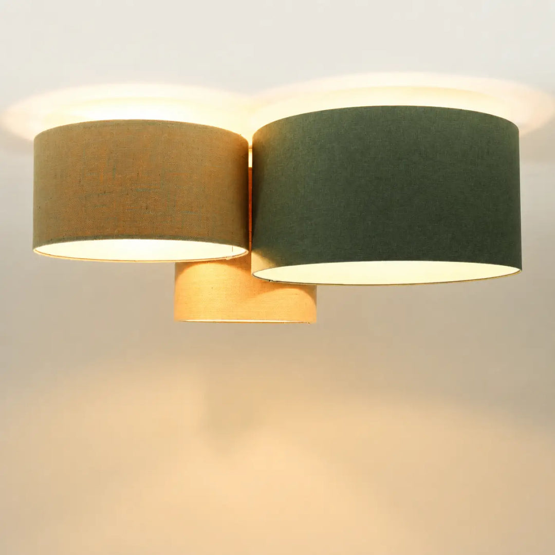 Luminaire plafond modern with two cylindrical fabric shades in beige vert and écru on warm metal base natural look