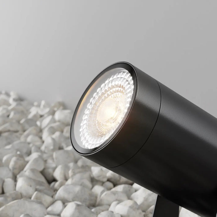 Luminaire extérieur piquet scope en acier noir avec spot cylindrique led à lentille facettée transparent