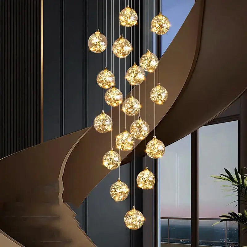 Plafonnier cascade moderne à LED dorées suspendues

