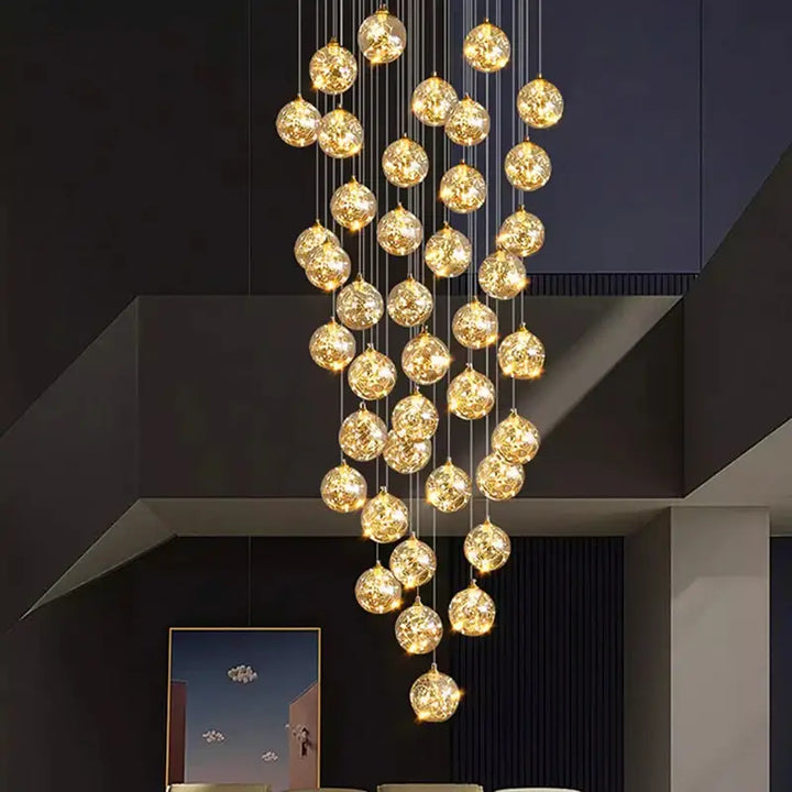 Plafonnier cascade moderne à LED dorées suspendues

