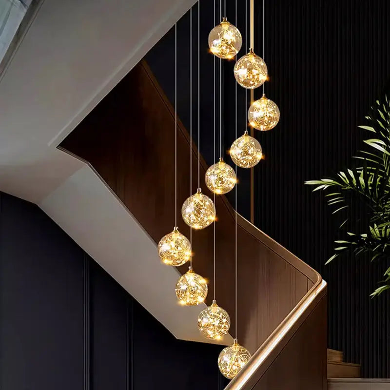 Plafonnier cascade moderne à LED dorées suspendues

