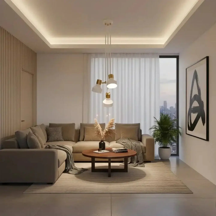 Beige sectional sofa with multiple cushions and a patterned throw blanket in a room featuring plafonnier dorothy blanc