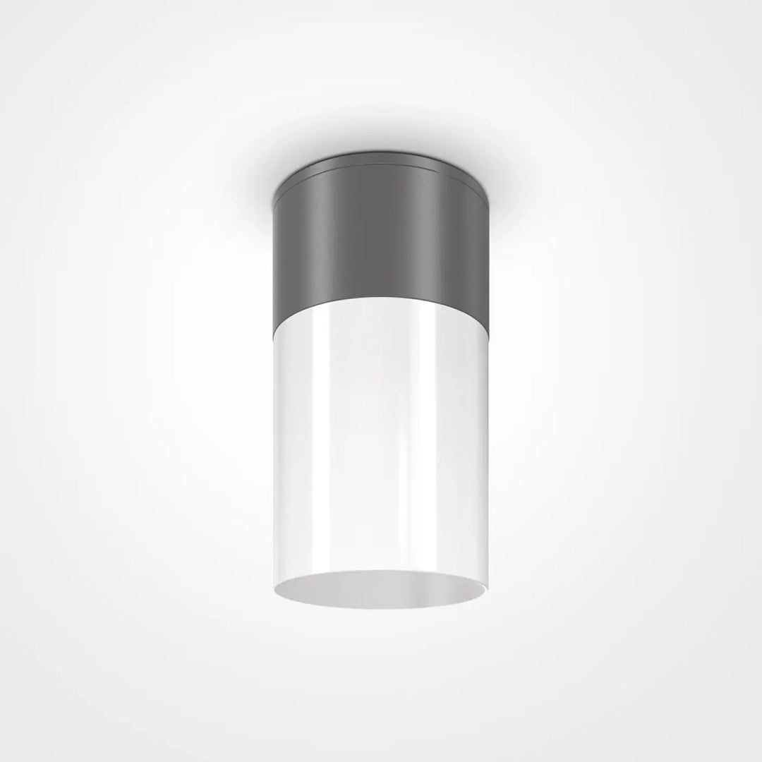 Plafonnier extérieur willis cylindrique avec corps en verre blanc translucide et dessus métallique gris mat offrant lumière dirigée