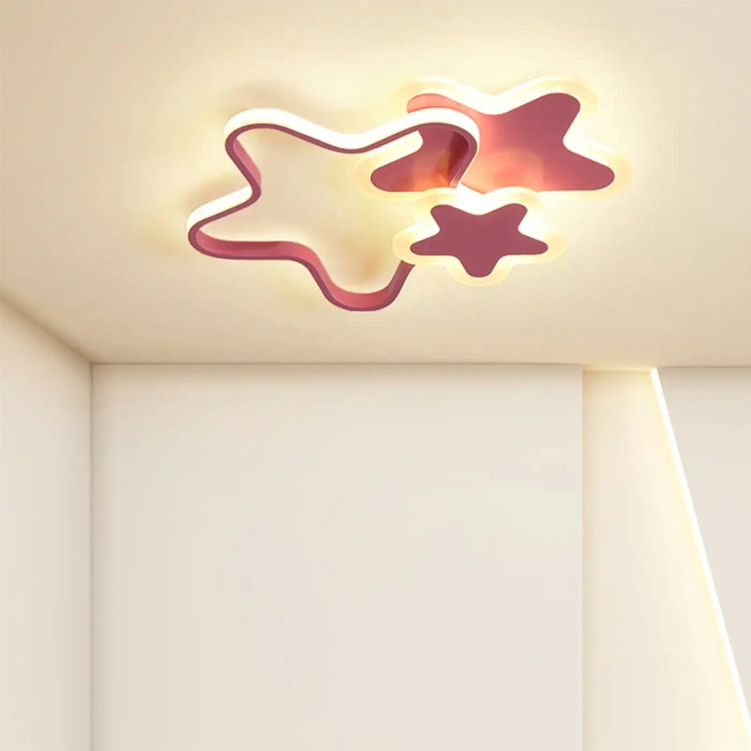 Luminaire plafonnier kidora led contemporain aux formes étoiles en design moderne avec accents rose rouge et lumière chaude