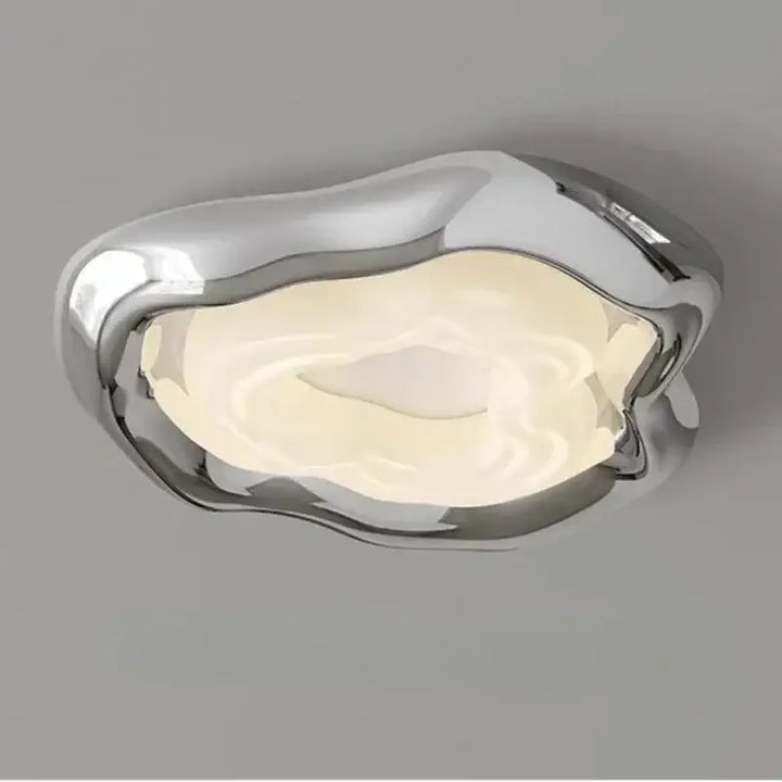 Plafonnier led design moderne chromé forme organique élégante

