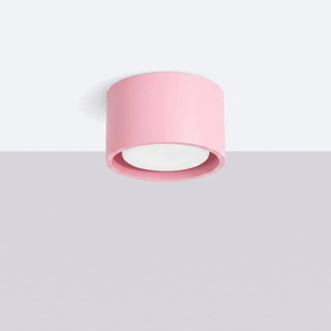 Plafonnier rond plat rose éteint, vue rapprochée