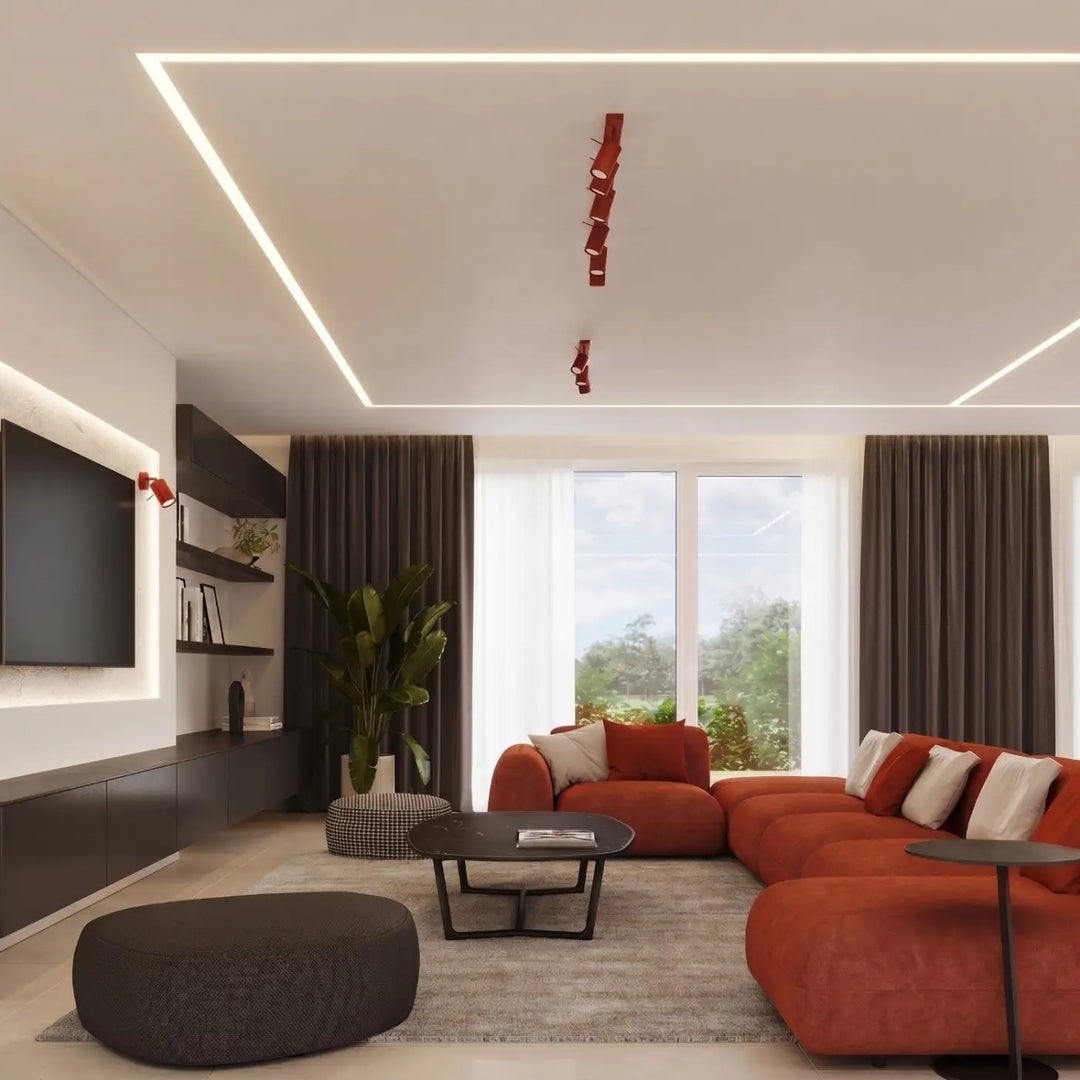 Plafonnier Ring rouge à rampe de spots orientables dans un intérieur contemporain
