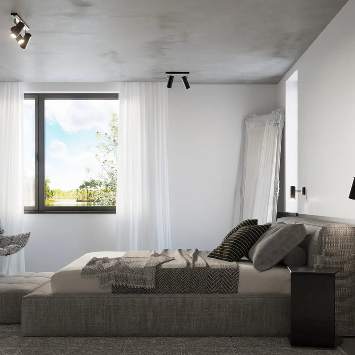 Luminaire plafonnier noir dans une chambre