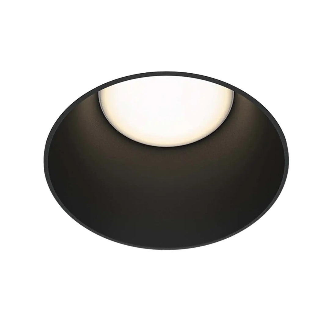 Spot share en acier encastré rond noir avec collerette visible et centre lumineux blanc chaud style Art déco moderne