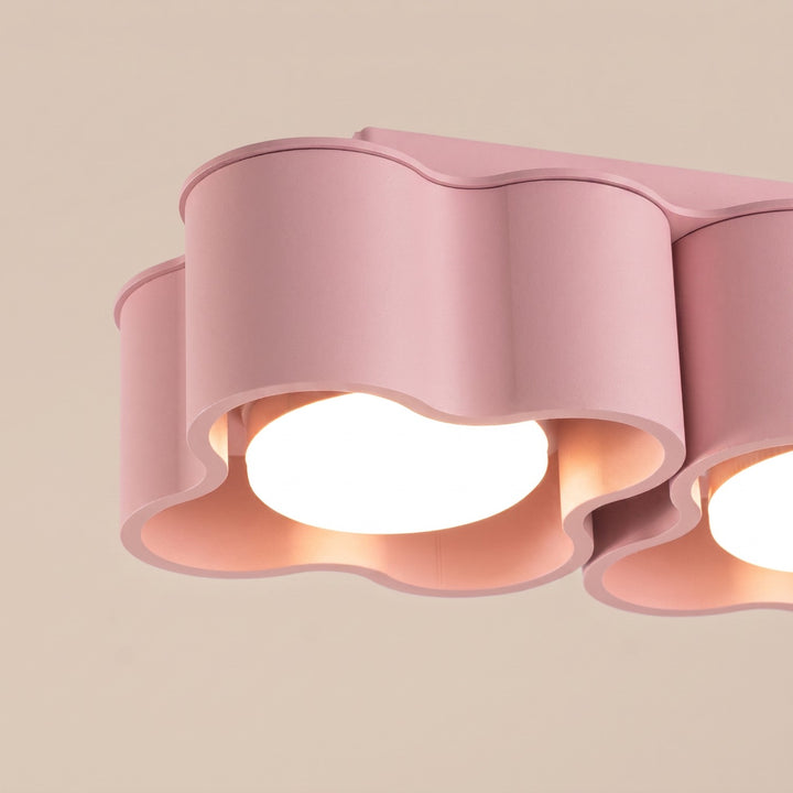 Plafonnier Ovio rose en aluminium, détail du contour ondulé