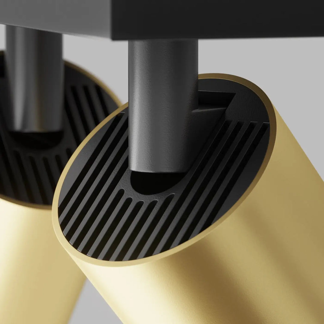 Spot double focus lampe cylindrique dorée avec têtes orientables, intérieur noir nervuré et longue base matte noire