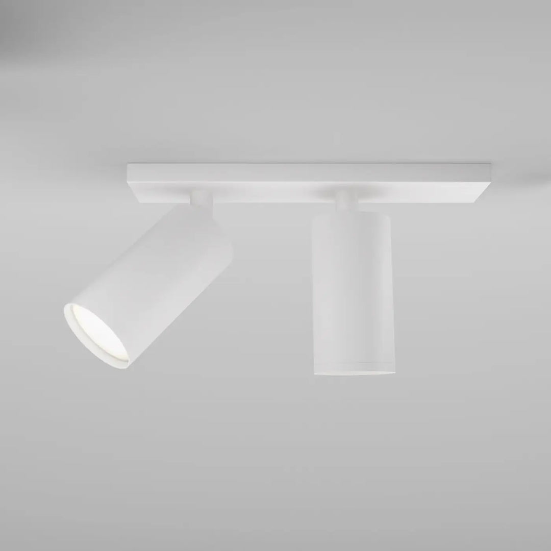 Spot double focus blanc moderne avec têtes orientables cylindriques et longue base plafond