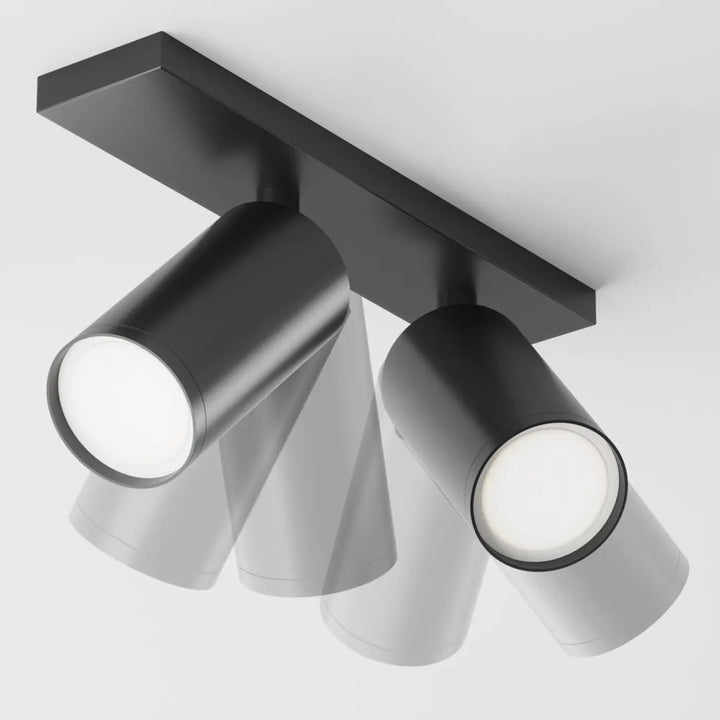 Spot double focus en finition mate noire avec têtes orientables cylindriques et longue base pour plafond
