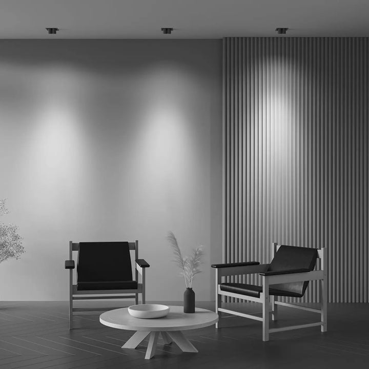 Minimalist white spot magnum coffee table with circular top and tripod base designed for modern interiors