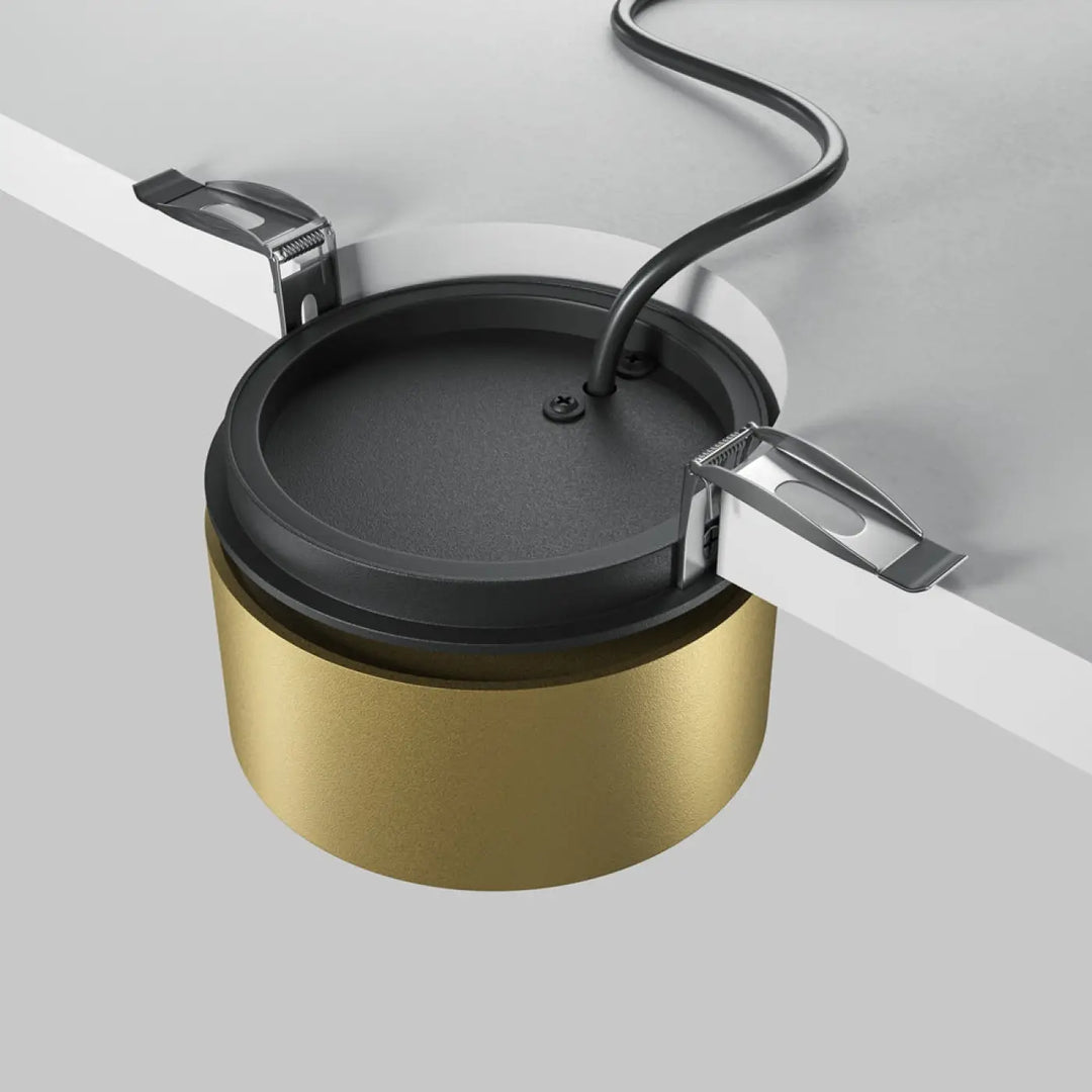 Dispositif de gestion de câbles spot onda cylindrique noir et or avec pinces métalliques pour spot encastrable led rétractable