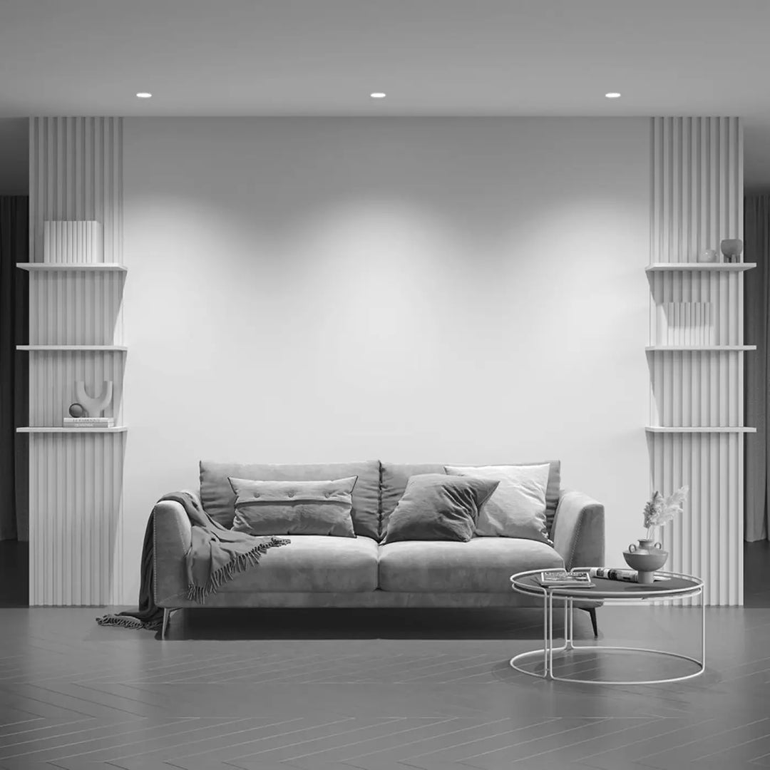 Sofa moderne gris en velours avec coussins assortis et plaid pour un spot encastré share élégant