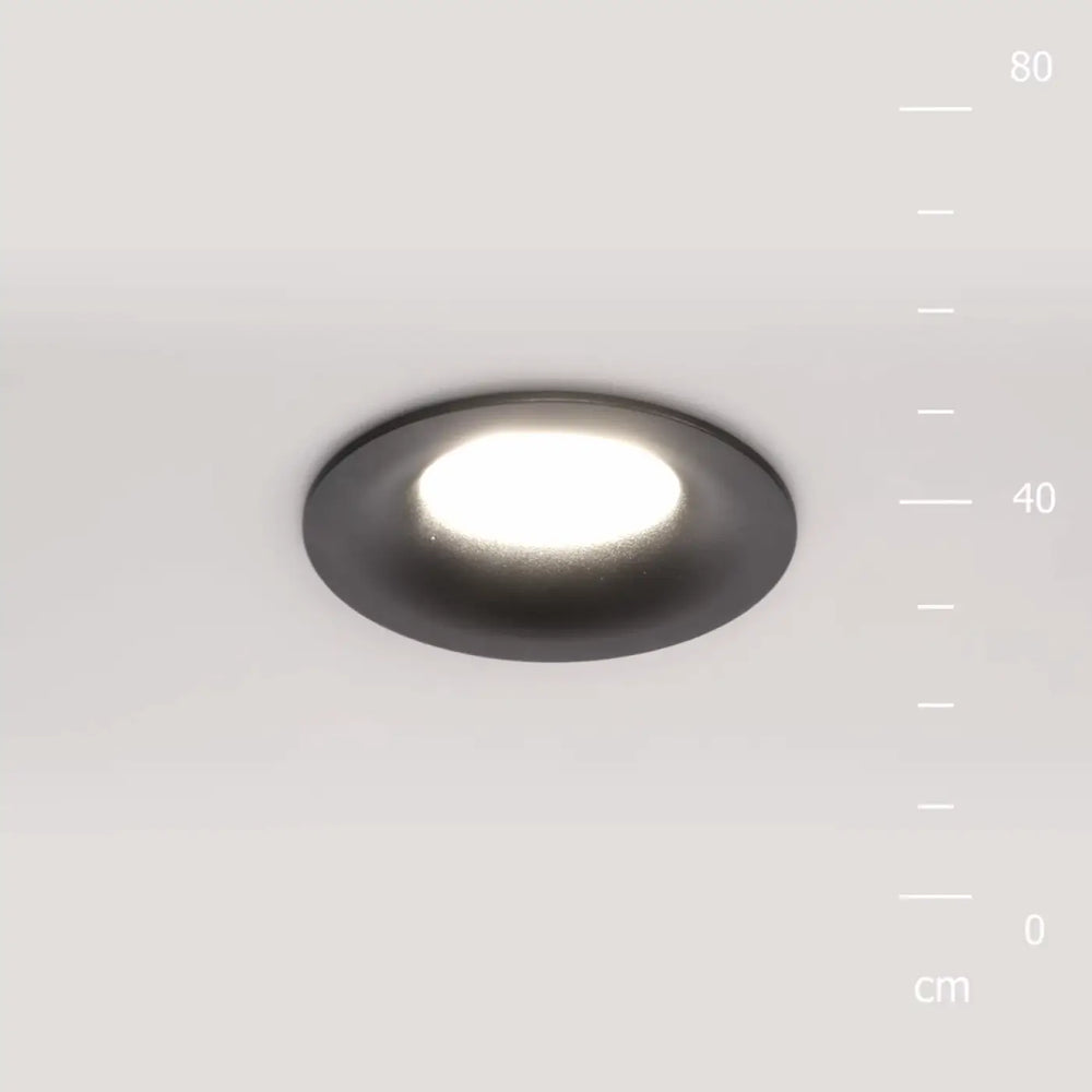 Spot encastré rond discret avec finition noire mate et éclairage général blanc doux circulaire