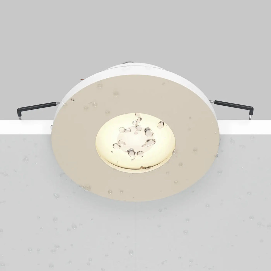 Spot Stark beige à faible profondeur avec panneau led doré et bras de fixation noirs pour spot encastré étanche