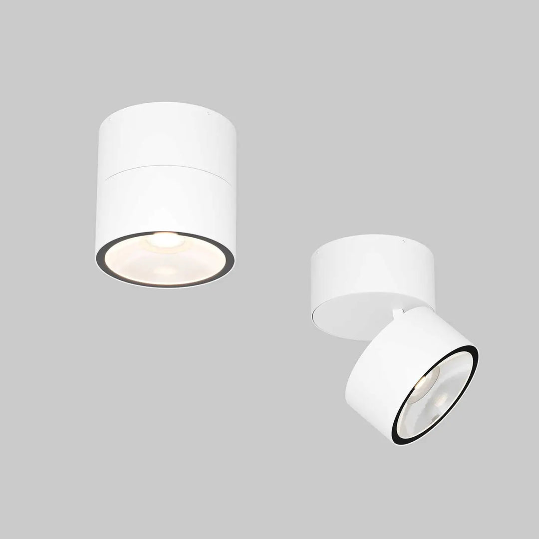 Spot spin led orientable blanc cylindrique avec bague noire et tête ajustable pour plafond intérieur