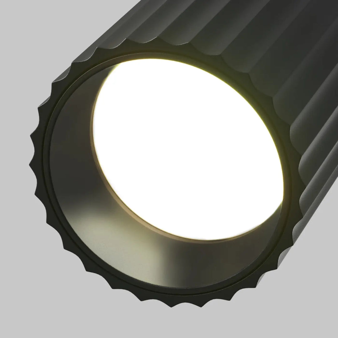 Spot orientable calipso cylindre cannelé noir avec face lumineuse blanche éclatante pour éclairage ciblé