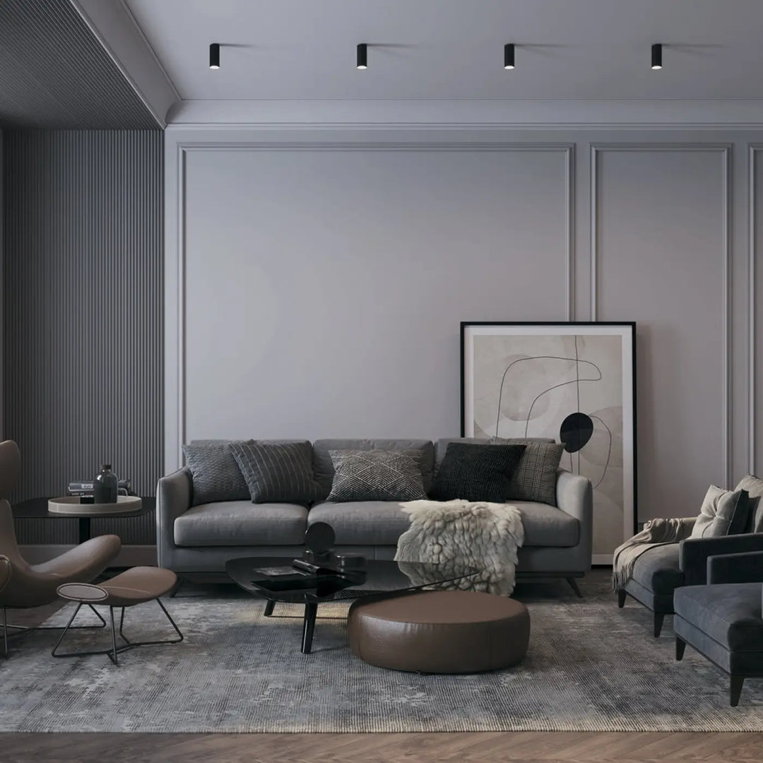 Canapé spot focus compact gris avec coussins texturés et couverture blanche, idéal pour lumière dirigée petit cylindre