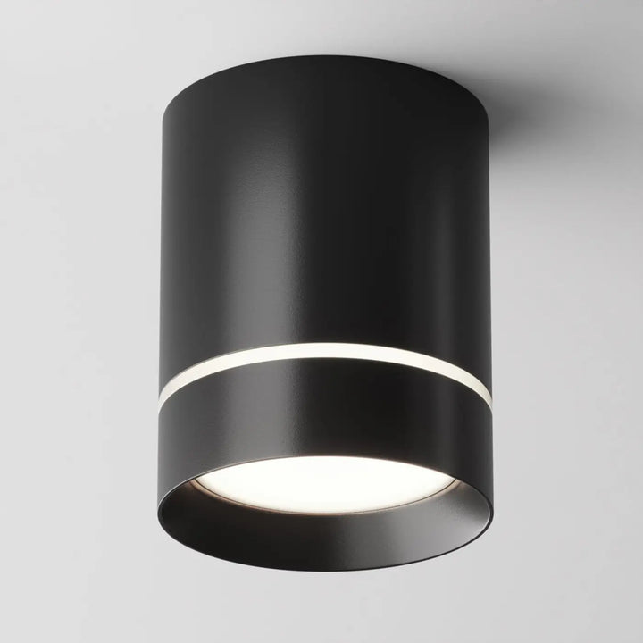 Spot orlo cylindre compact en acier noir avec finition mate et anneau blanc lumineux pour éclairage plafond
