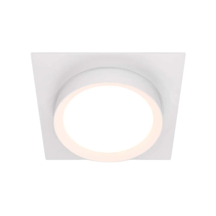 Spot semi encastré cadre carré blanc avec disque lumineux circulaire au centre pour un éclairage doux