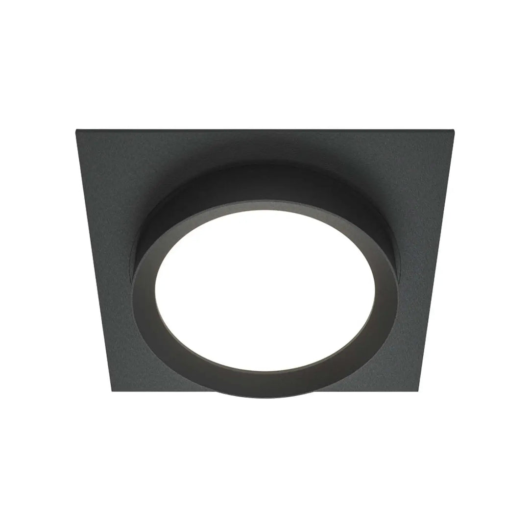 Spot semi-encastré cadre carré noir avec disque lumineux circulaire au centre pour éclairage intérieur