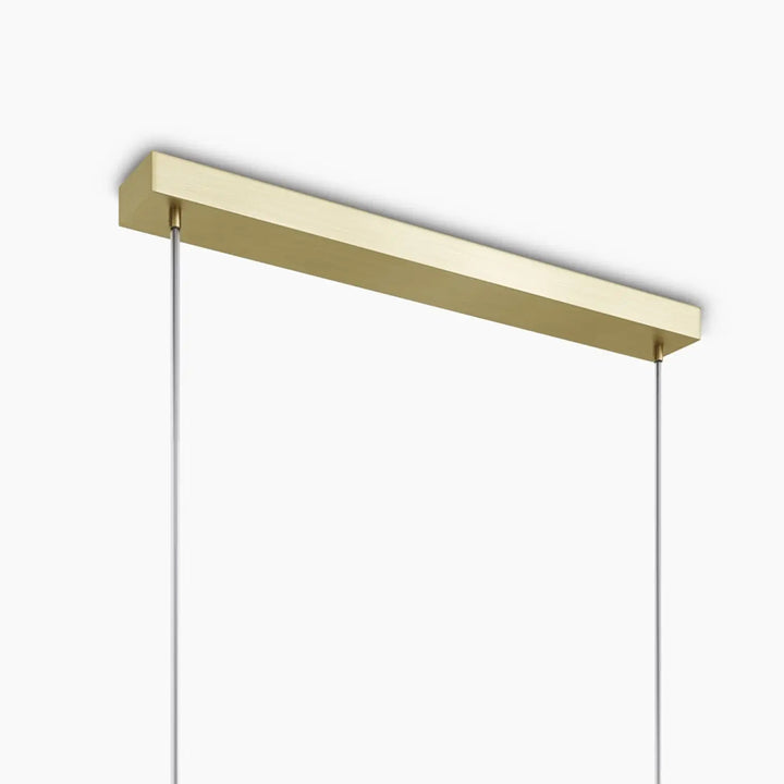 Suspension antic linéaire en finition or avec verre strié et câbles fins idéale pour salle à manger moderne