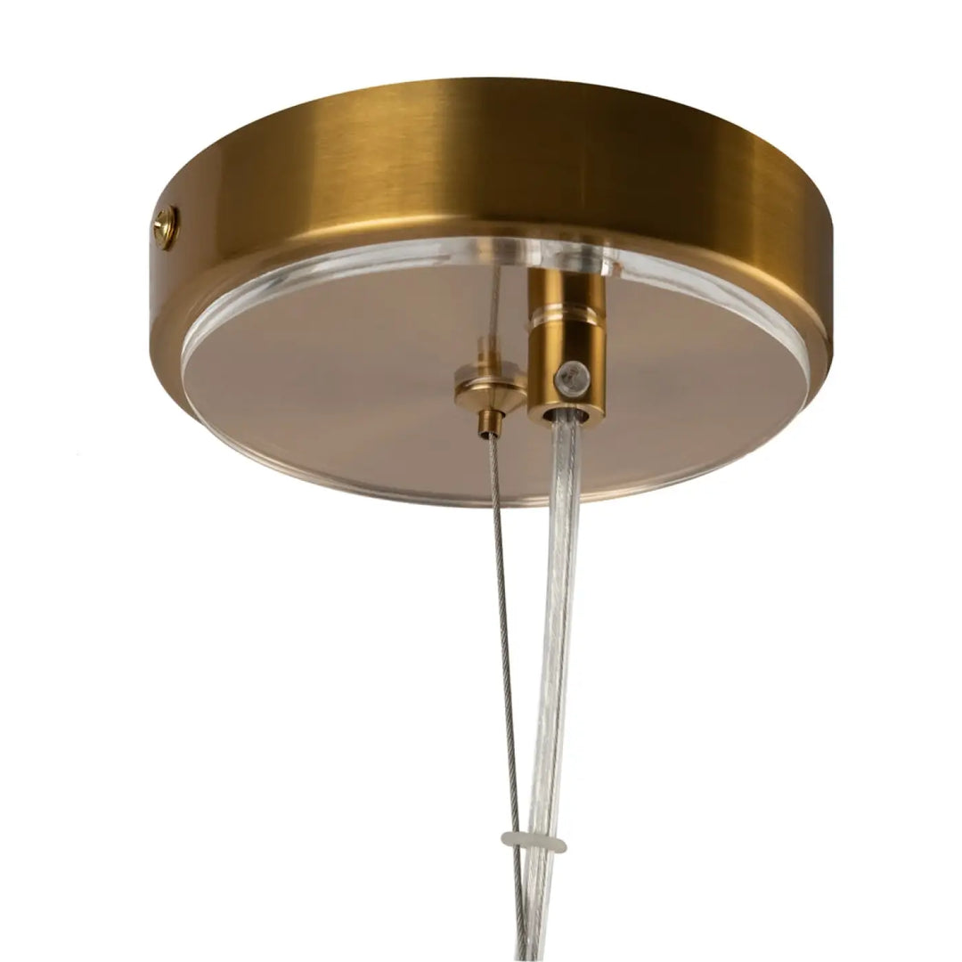 Suspension luminaire arco avec finition laiton, canopy circulaire en métal brossé et câble en verre strié clair