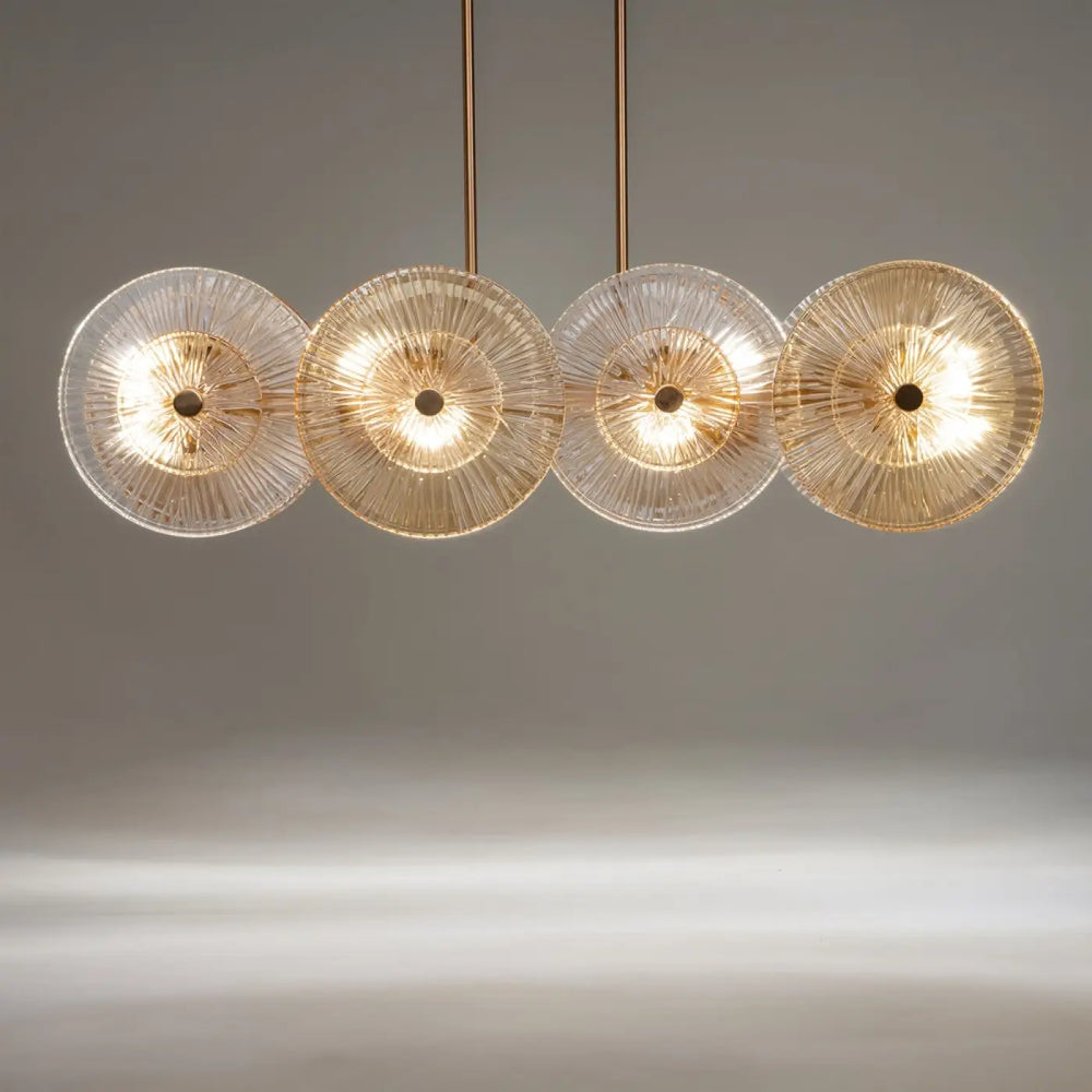 Suspension aster moderne à quatre lumières avec disques en verre ambré et monture dorée en métal