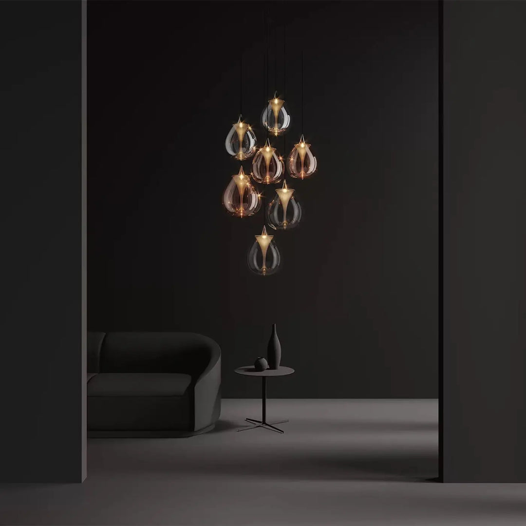 Suspension luminaire bond avec double disque convexe en verre soufflé teardrop ambré et clair suspendu par cordons métalliques fins