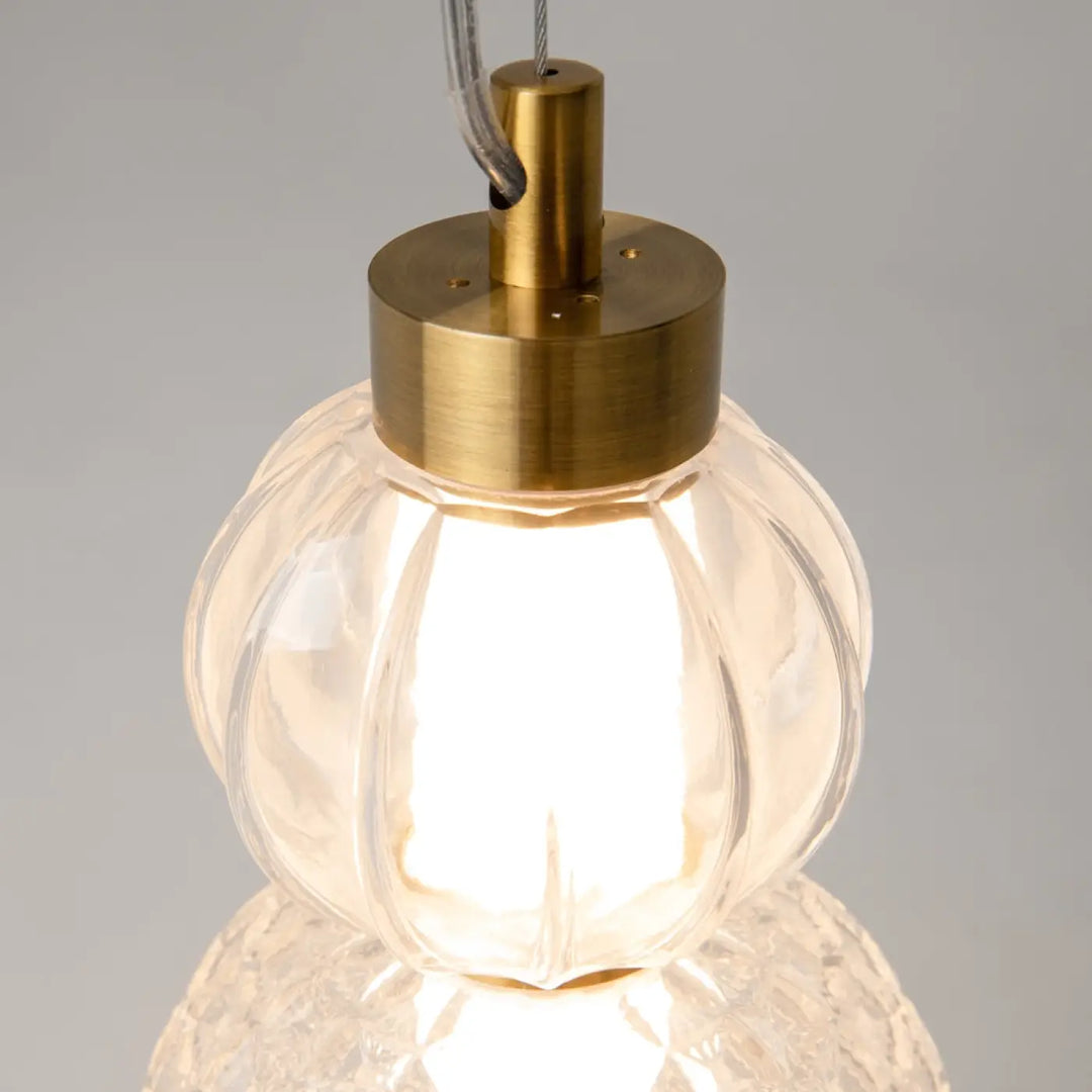 Suspension collar en verre facetté clair avec métal doré et lumière à 360 degrés pour un éclairage élégant