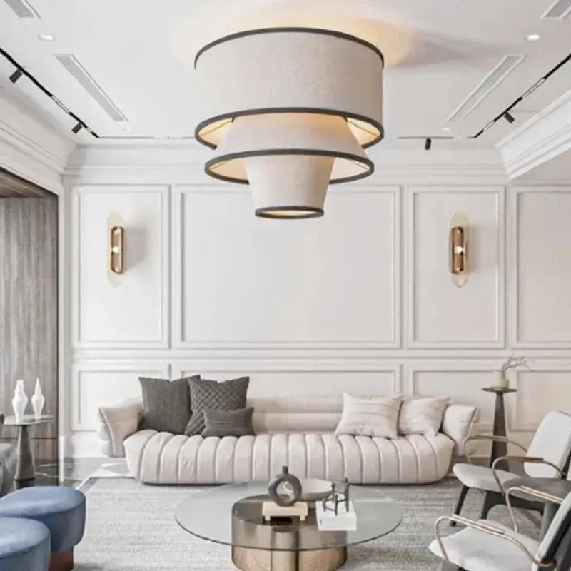 Suspension design conique en tissu beige et cerclages noirs

