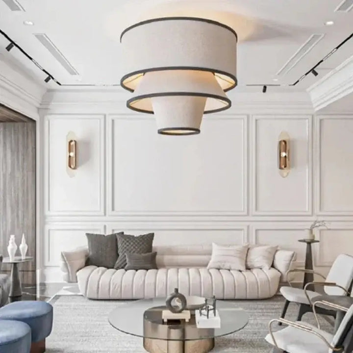 Suspension design conique en tissu beige et cerclages noirs

