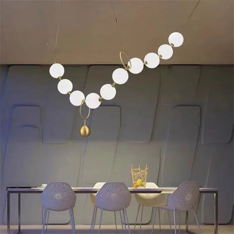 Suspension moderne boules lumineuses doré blanc raffiné