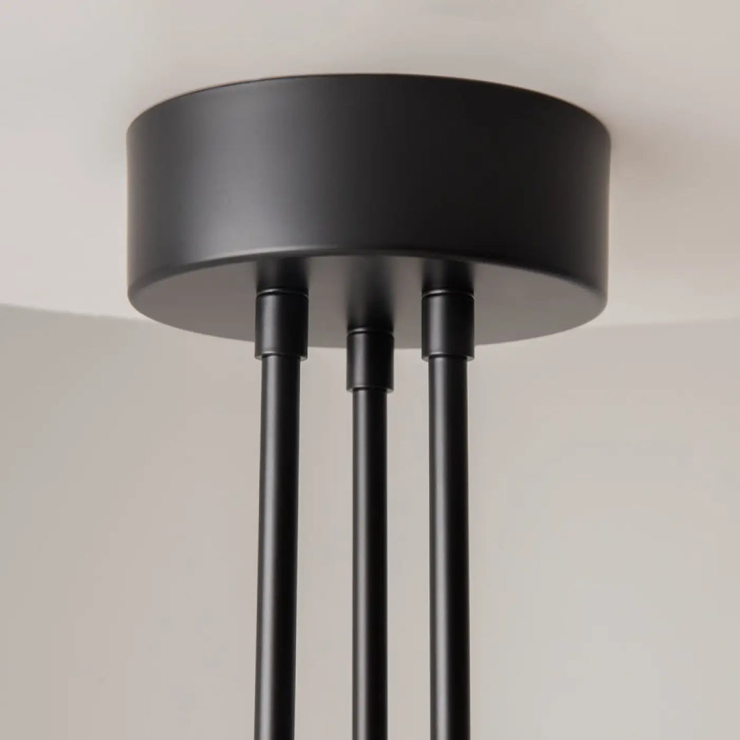 Suspension fad bras articulés en métal noir avec finition mate et trois tiges fines pour éclairage plafond moderne