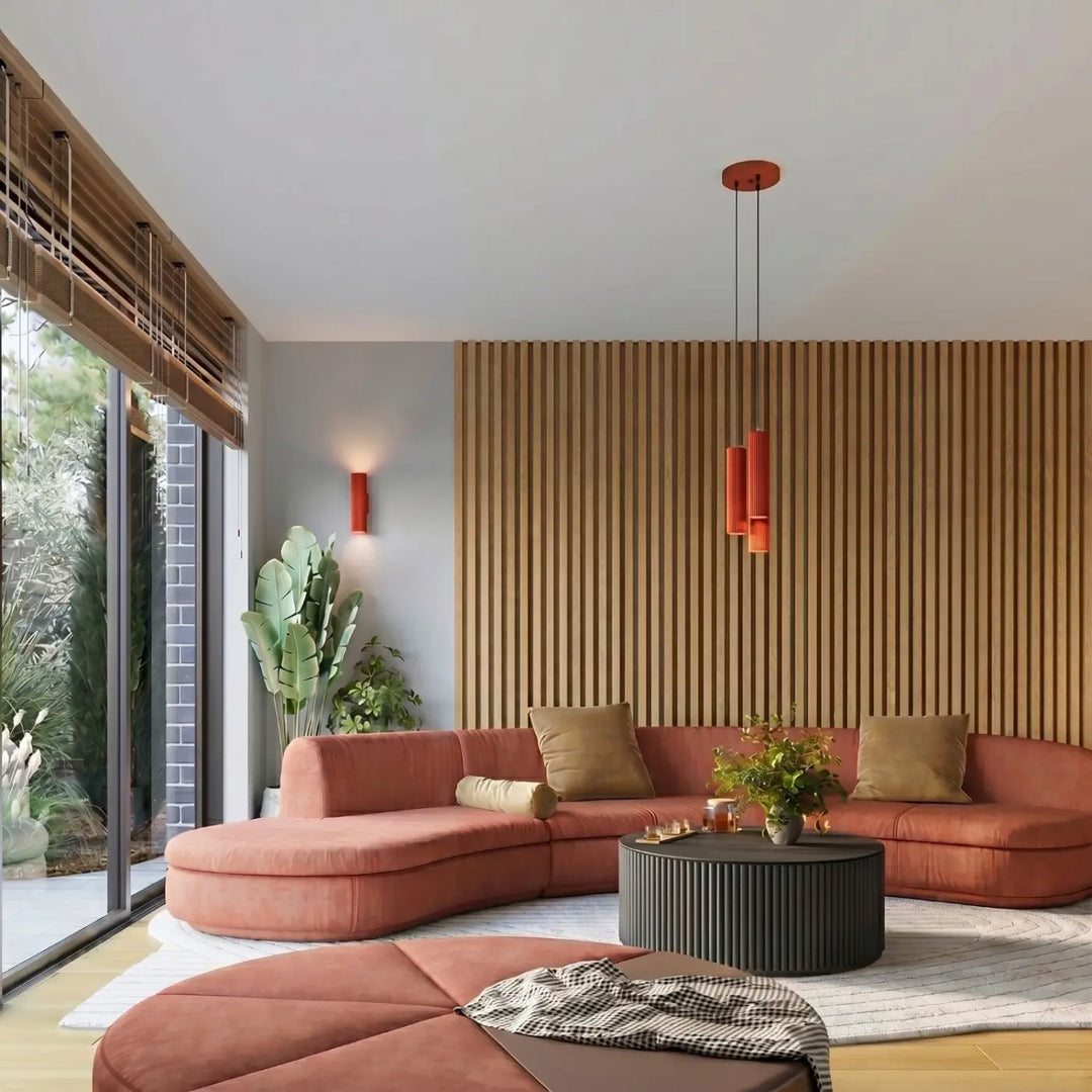 Suspension Karbon rouge en grappe de 3 cylindres nervurés dans un intérieur contemporain