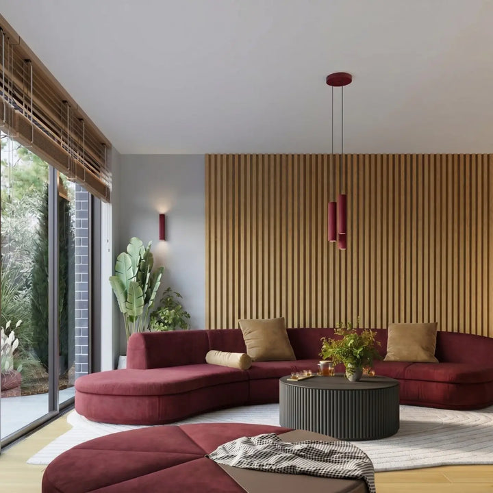 Suspension Karbon bordeaux en grappe de 3 cylindres nervurés dans un intérieur contemporain