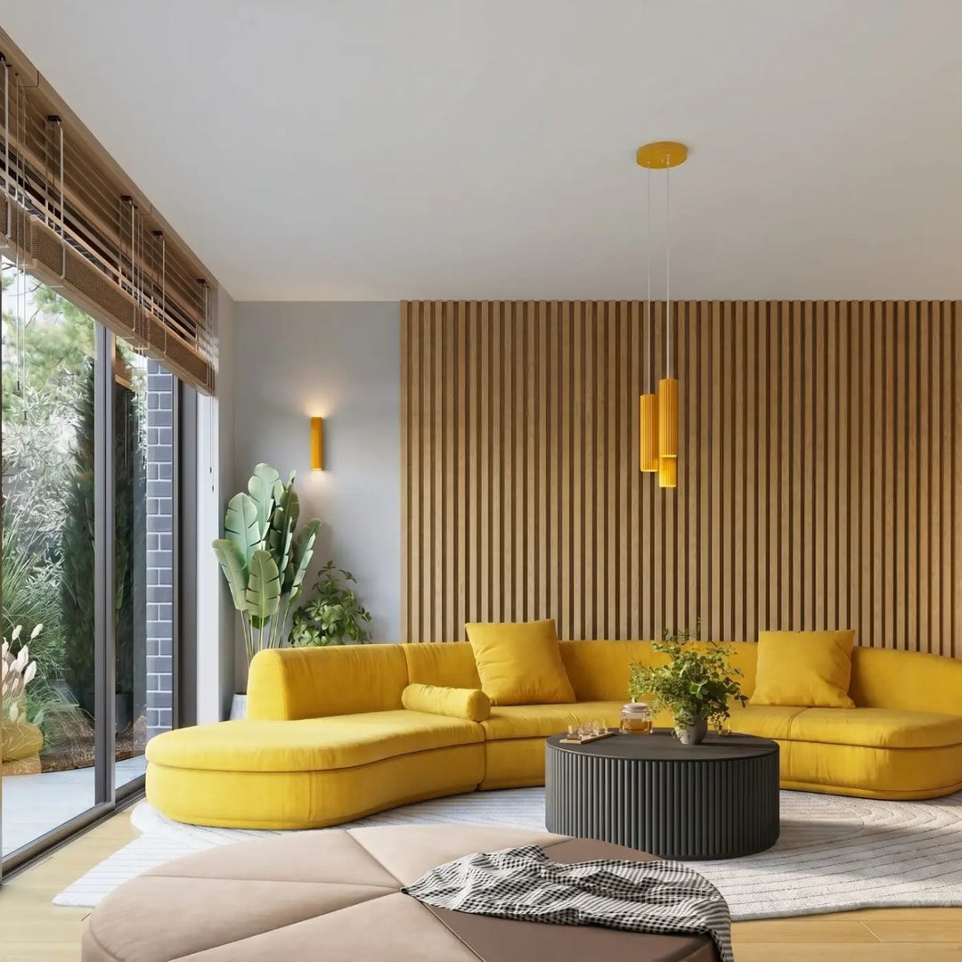Suspension Karbon jaune en grappe de 3 cylindres nervurés dans un intérieur contemporain