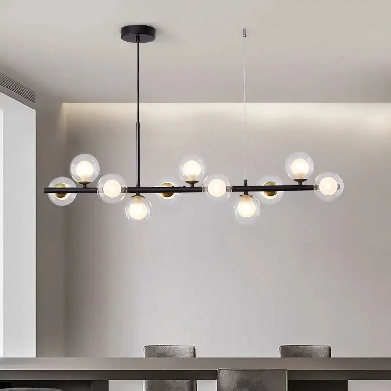 Suspension luminaire à boules de verre teinté sur un support noir


