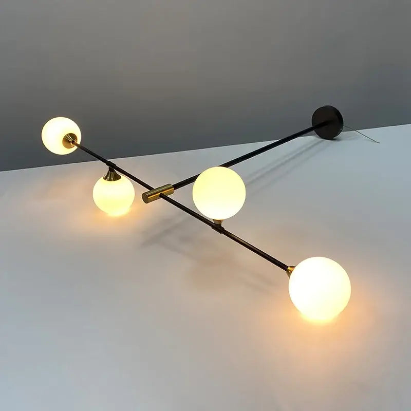 Suspension luminaire boules en verre et structure noire moderne