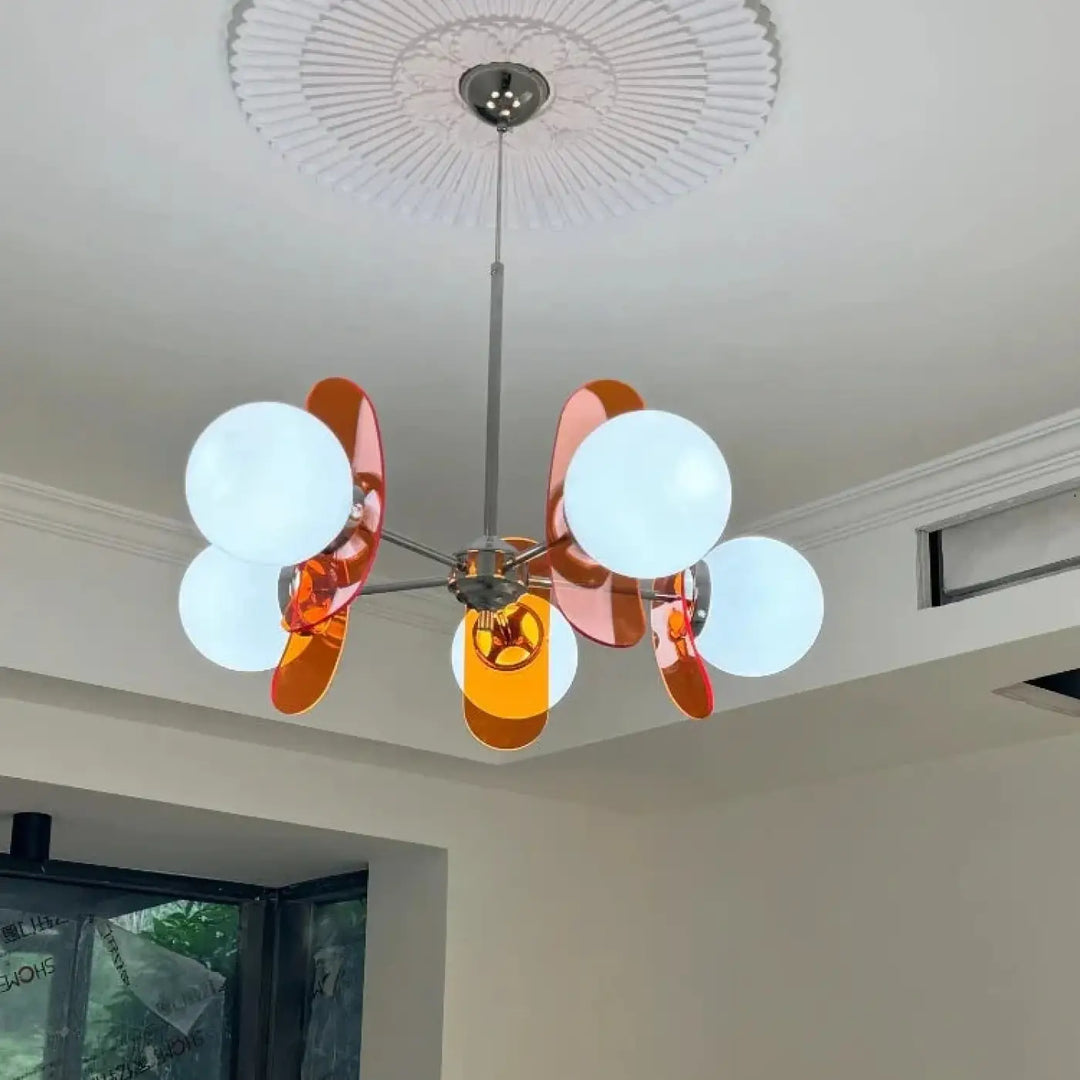 Suspension luminaire melios avec ampoules sphériques blanches givrés et pétales en verre orange, ambre et jaune translucide luminaire chic