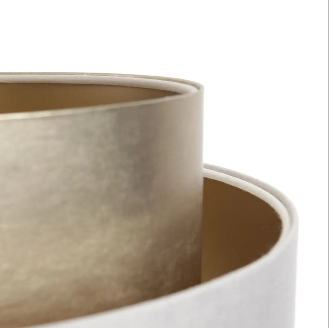 Matte gold cylindrical suspension luminaire crème doblo with smooth textured surface and rounded edges