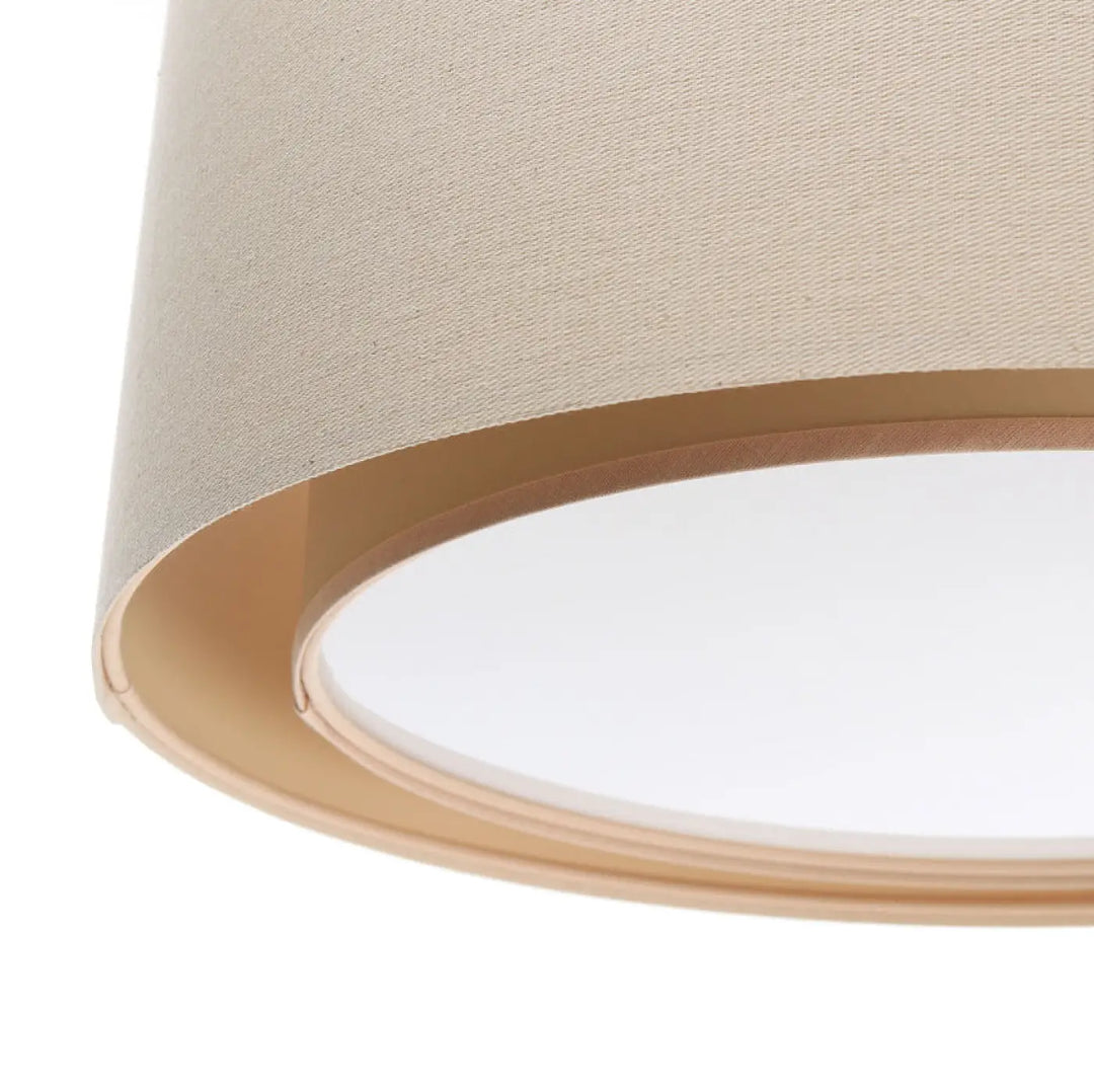 Suspension luminaire crème avec abat-jour en tissu beige et bord métal doré pour une décoration élégante