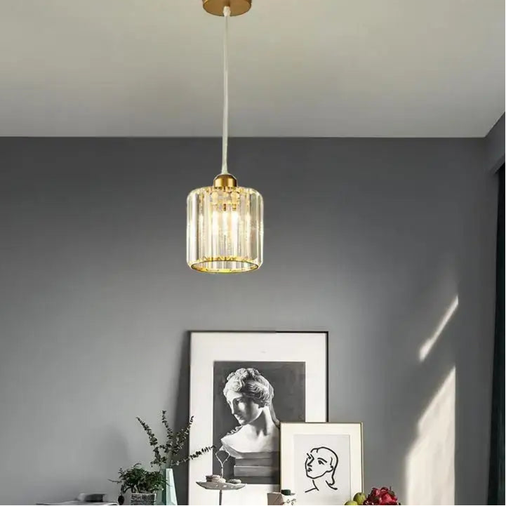 Suspension luminaire cristal doré et noir cylindrique élégant

